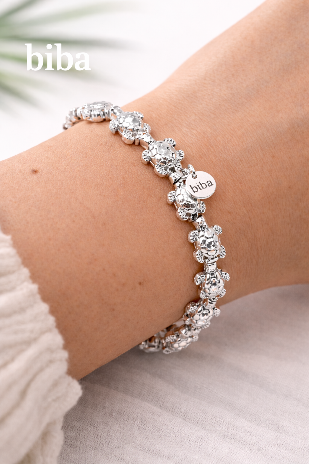 biba Armband mit maritimen Schildkröten aus glänzendem silberfarbenem Metall, elastisch, 18 cm
