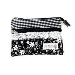 Schwarzes Canvas-Täschchen mit buntem Blumenmuster und weißen Punkten, kleine Kosmetiktasche aus robustem Stoff mit Reißverschluss, kompakte Größe für unterwegs