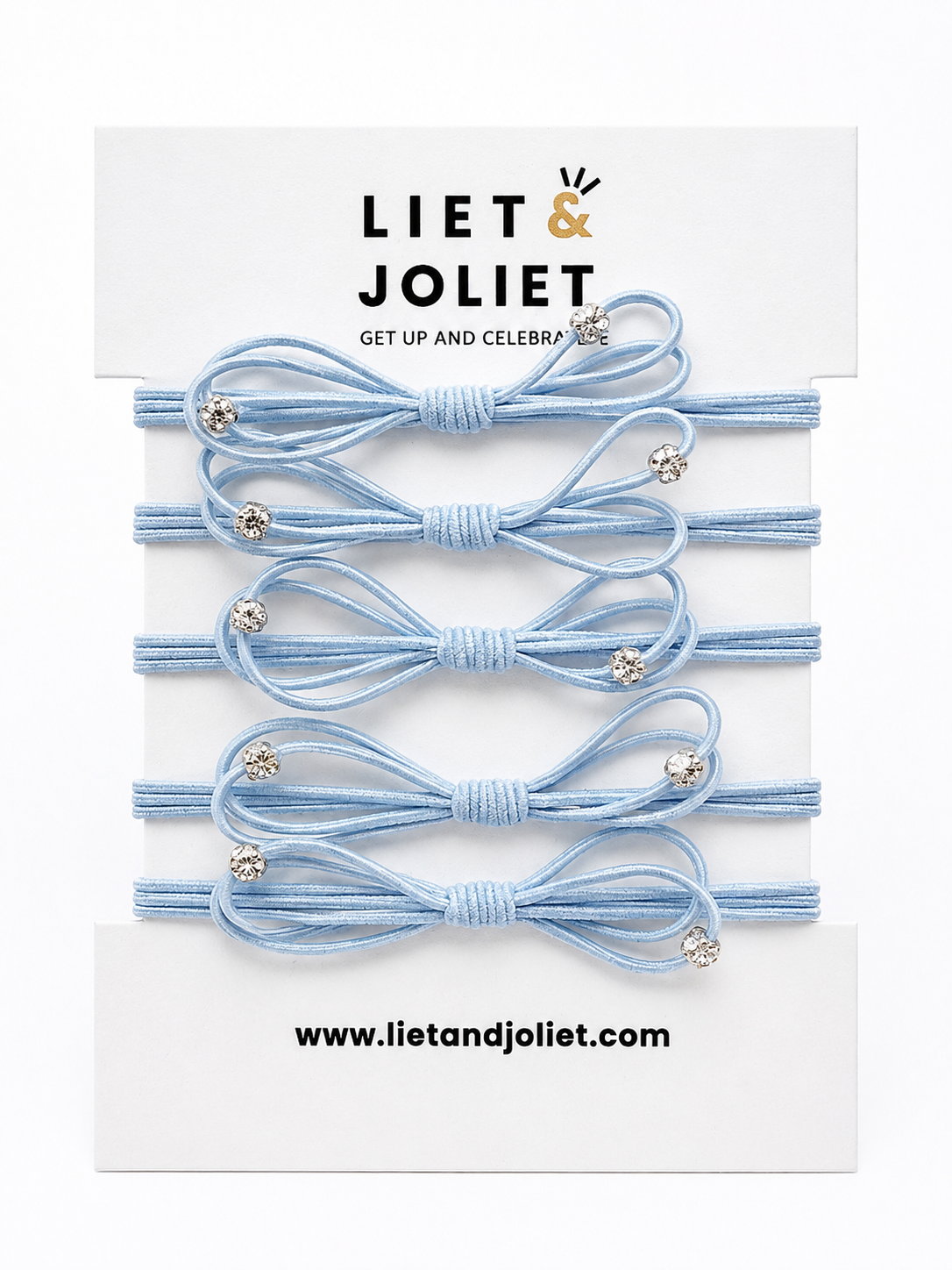 5 elastische Haargummis in Hellblau mit funkelnden Kristallsteinen auf Produktkarte.