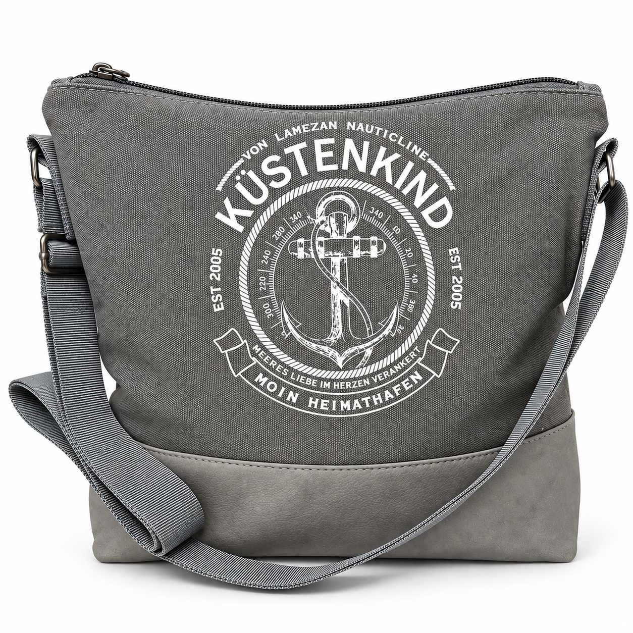 Graue maritime Umhängetasche Küstenkind mit weißem Anker- und Kompassmotiv, Schriftzug „Moin Heimathafen“, abgesetztem grauem Taschenboden und Schulterriemen.