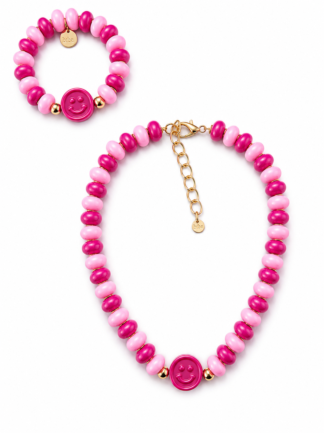 Schmuckset aus Statement-Kette und passendem Armband in Rosa und Pink mit Smiley-Anhänger, Resinperlen und goldfarbenen Brass-Details.