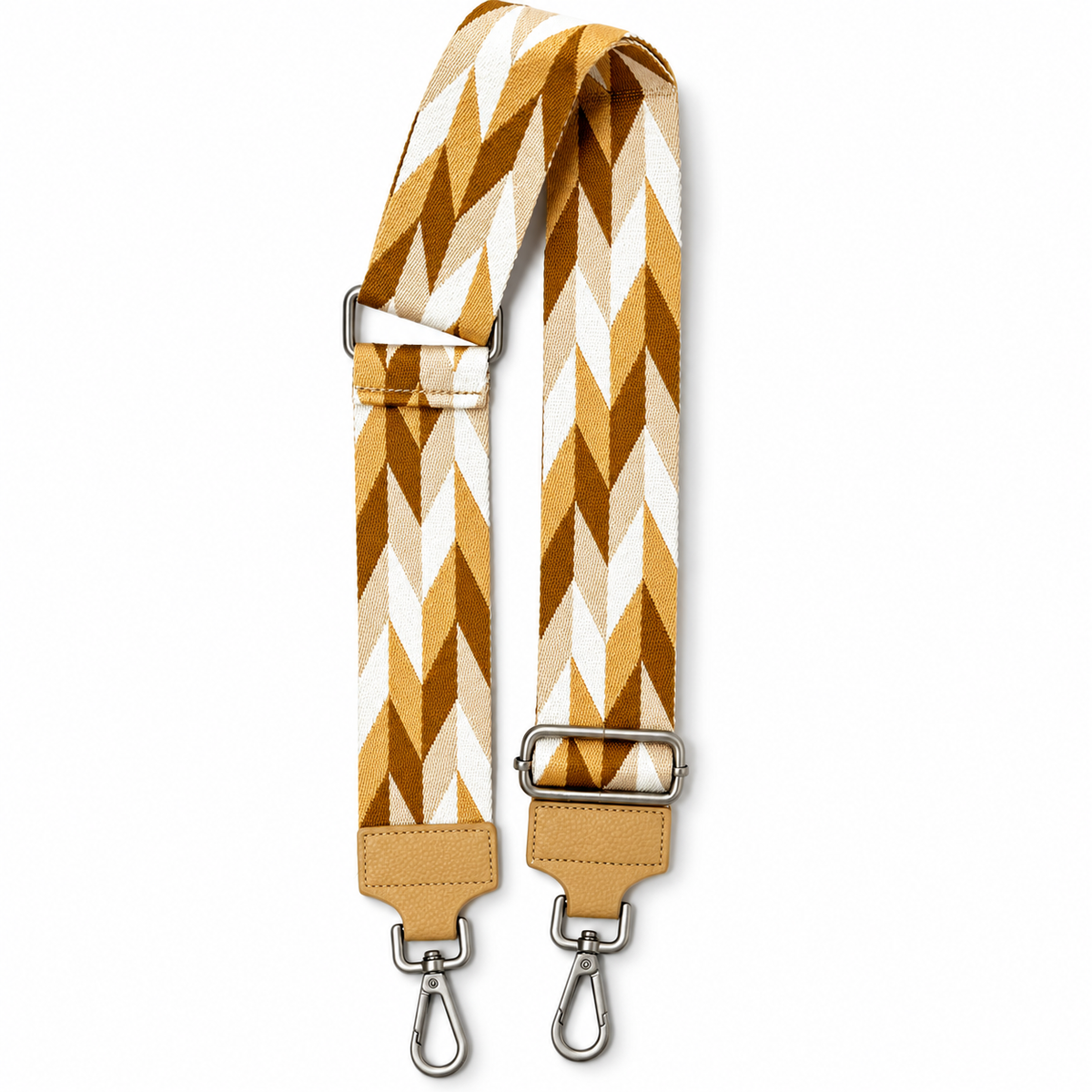 Verstellbarer Schulterriemen mit Zickzackmuster in Caramel, Braun, Beige und Weiß, beigen Kunstlederenden und silberfarbenen Karabinern.